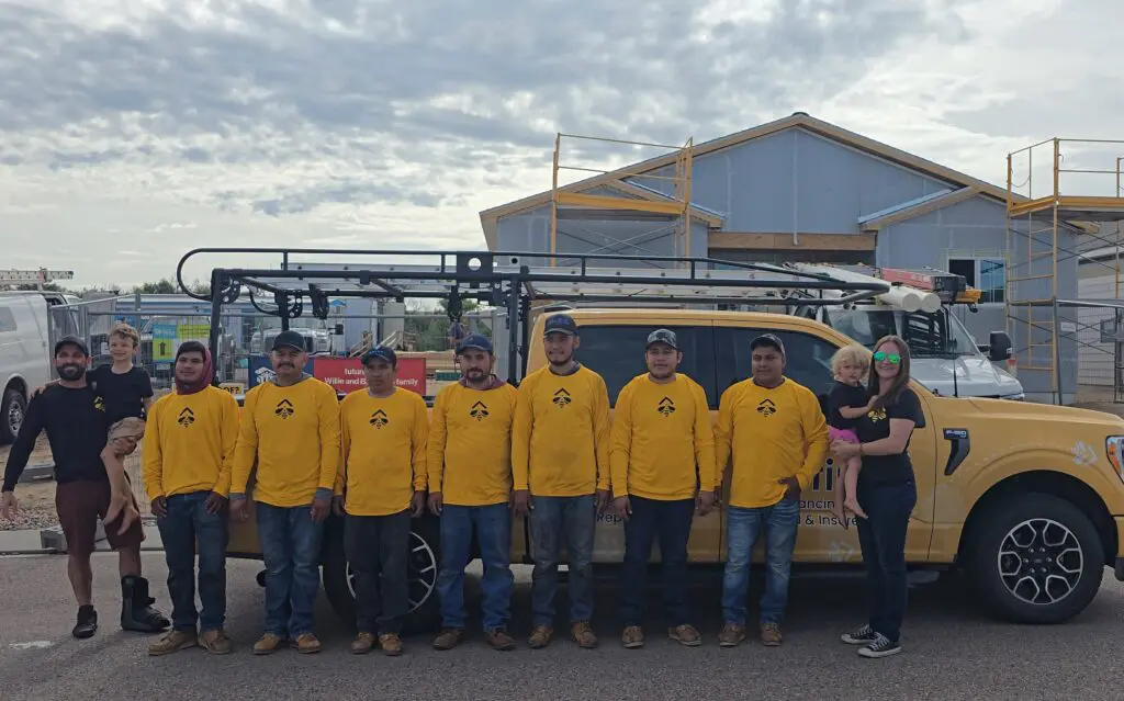 Bumble Roofing of Colorado Springs team poses for a picture during the Pikes Peak veteran home build.