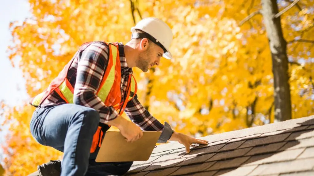 Insurance adjuster inspecting a roof for an insurance claim in Colorado Springs.
