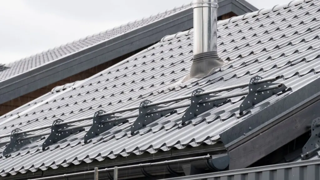 Metal roof with snow guards installed by Bumble Roofing in Colorado Springs, CO.
