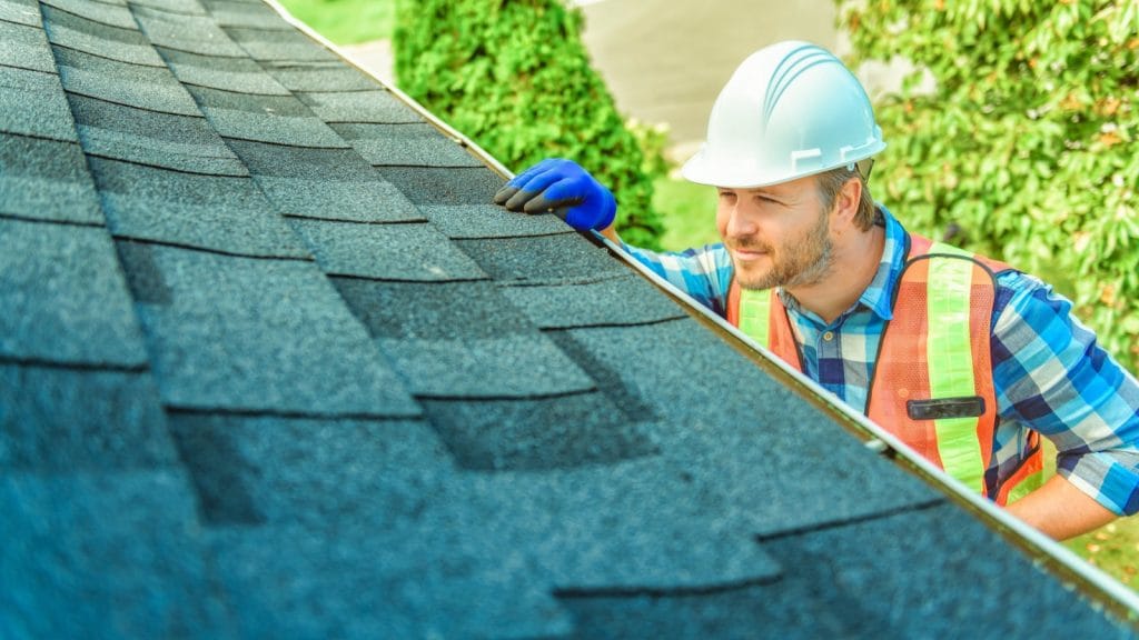 Bumble Roofing inspecting a roof's fire rating in Colorado Springs, CO.