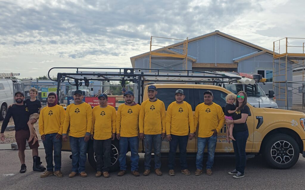 Bumble Roofing of Colorado Springs team poses for a picture during the Pikes Peak veteran home build.