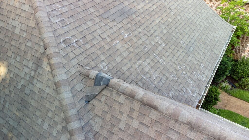 Visible signs of roof damage marked up after a roof inspection by Bumble Roofing in Colorado Springs, CO.