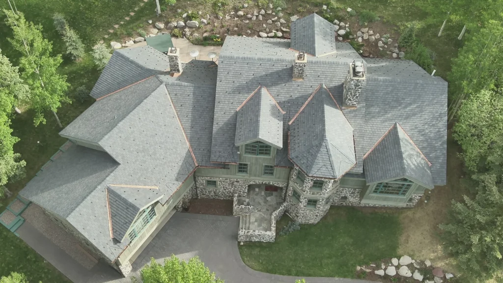 Aerial view of completed F-Wave XTD synthetic shingle roof in Classic Slate Grey on a Snowmass Village mountain home