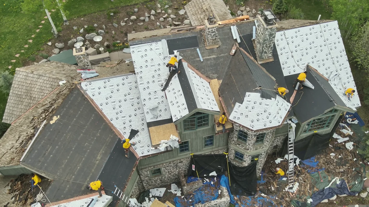 Aerial view of F-Wave XTD synthetic shingle roof installation in progress on Snowmass Village home
