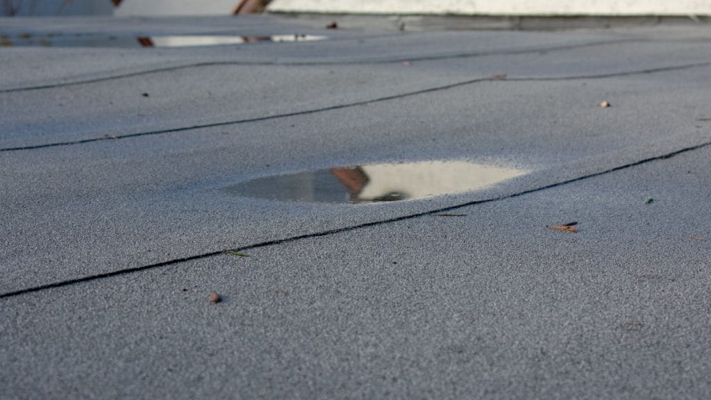 Ponding on flat roofs is a common roofing problem in Fairfield, CT.