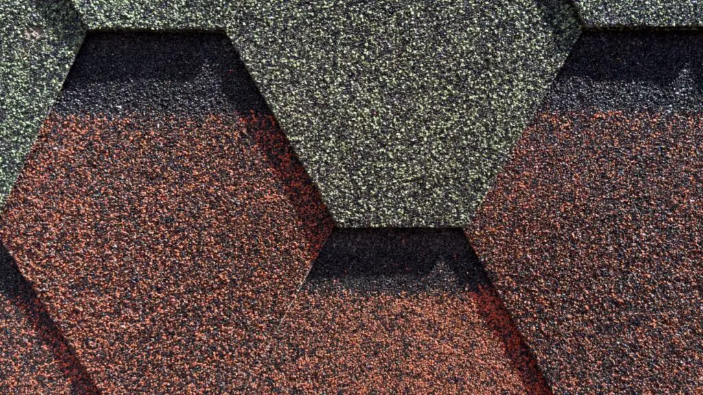 Asphalt roof shingles with different ratings overlapped.