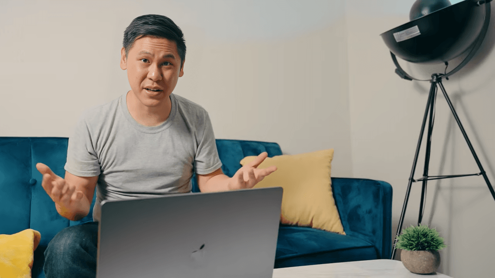 man talking using laptop