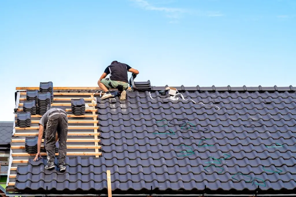 Skilled roofers completing a full roof upgrade