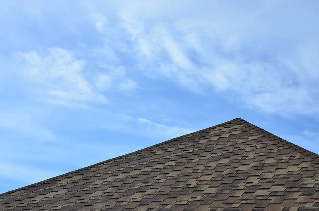 Closeup of the top of a shingle roof