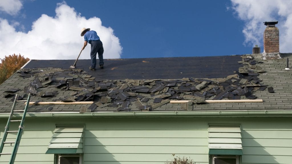 Bumble roofing removing shingles to install a metal roof