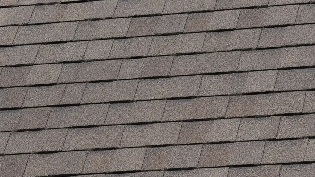 Close up image of a 3-tab shingle roof.